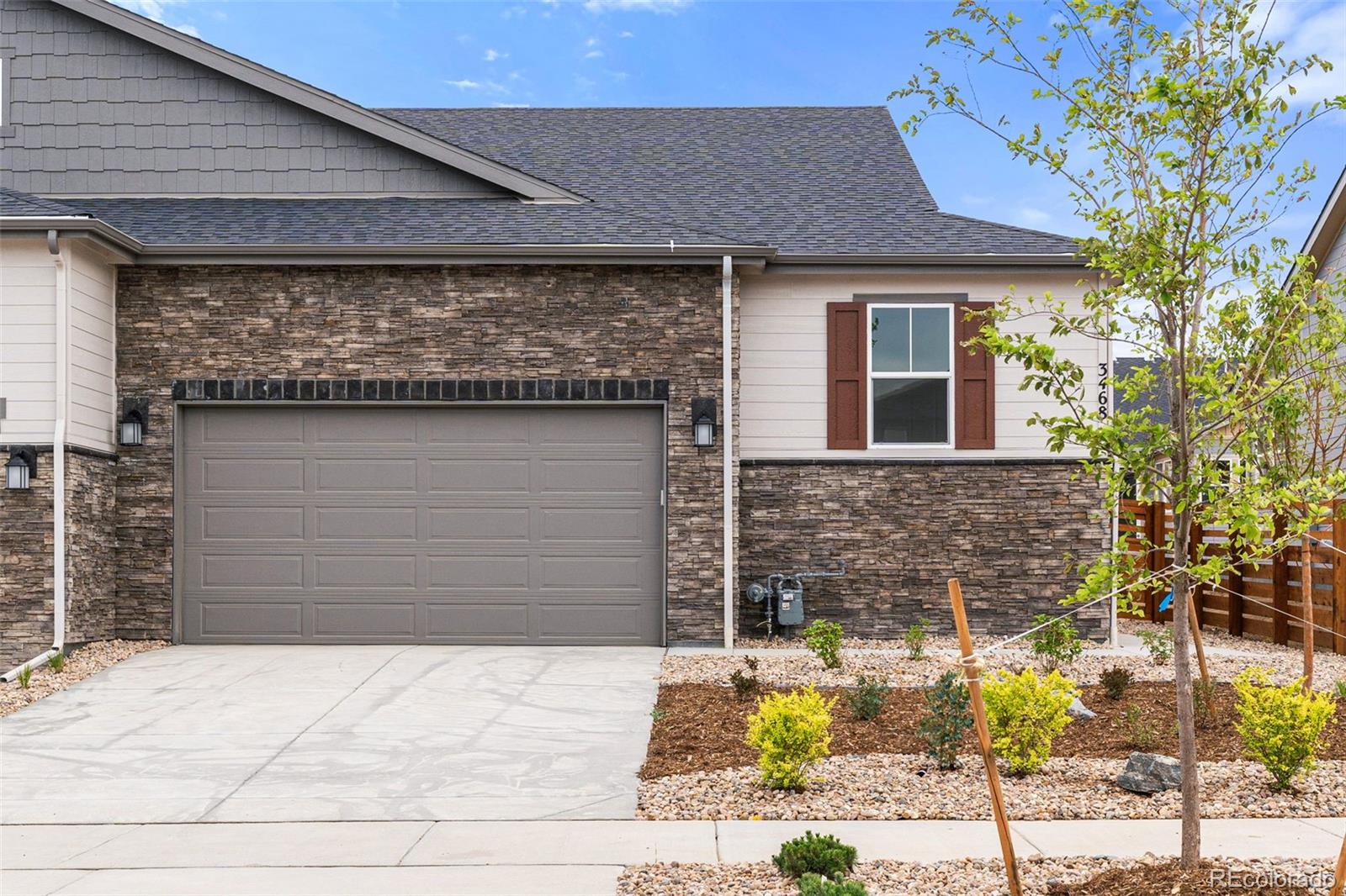 a front view of a house with parking