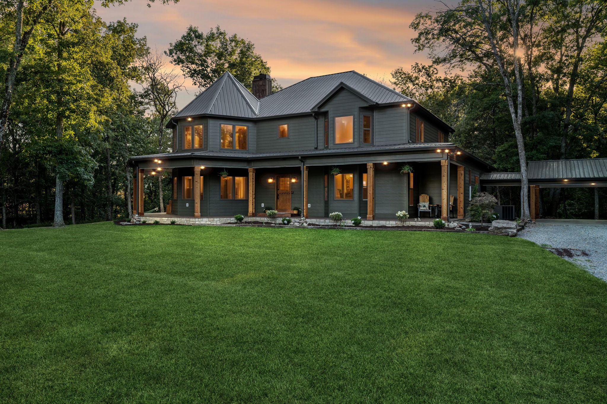 a front view of a house with garden and porch