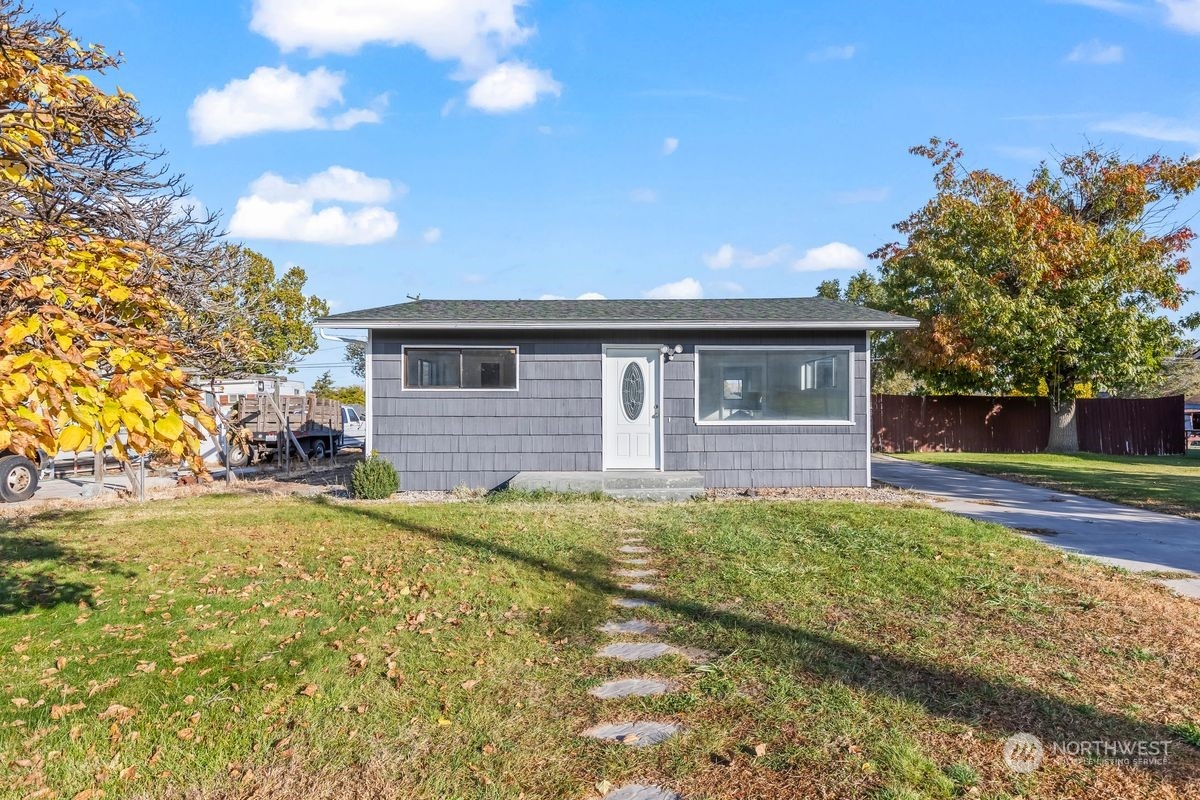 a front view of a house with a yard