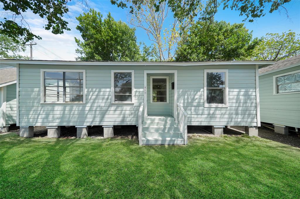 front view of a house with a yard