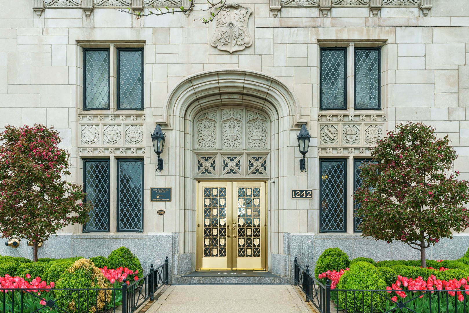 a front view of a house with flowers