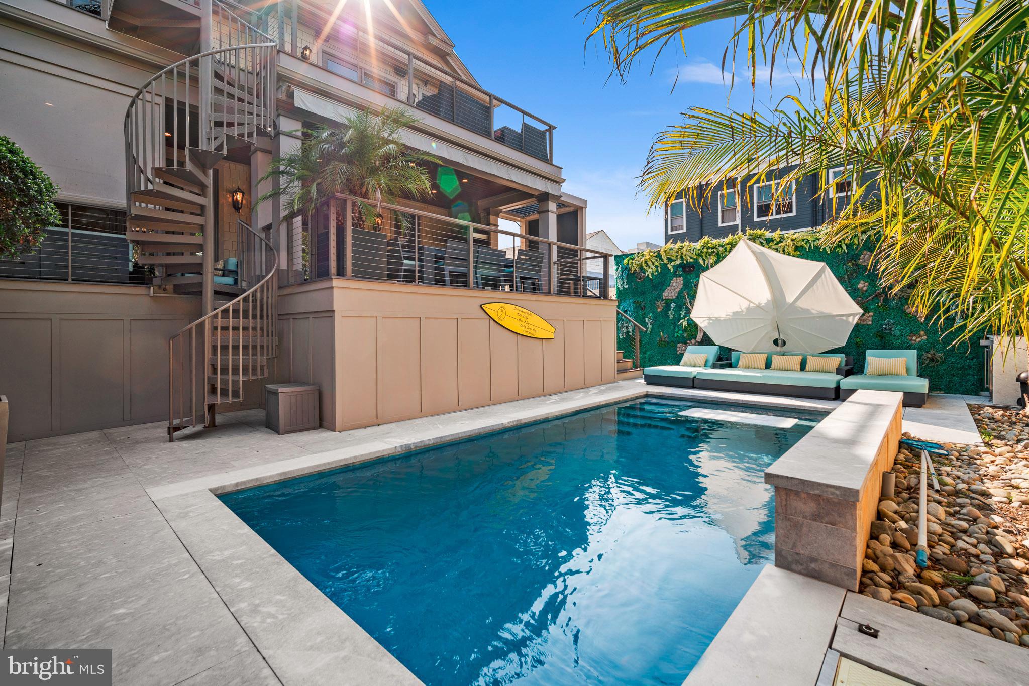 a view of a swimming pool with a lounge chairs