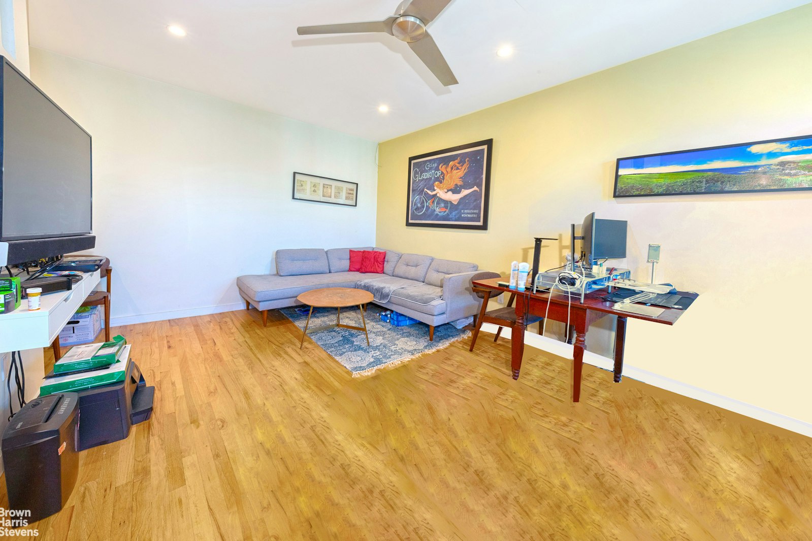 a living room with furniture and a flat screen tv