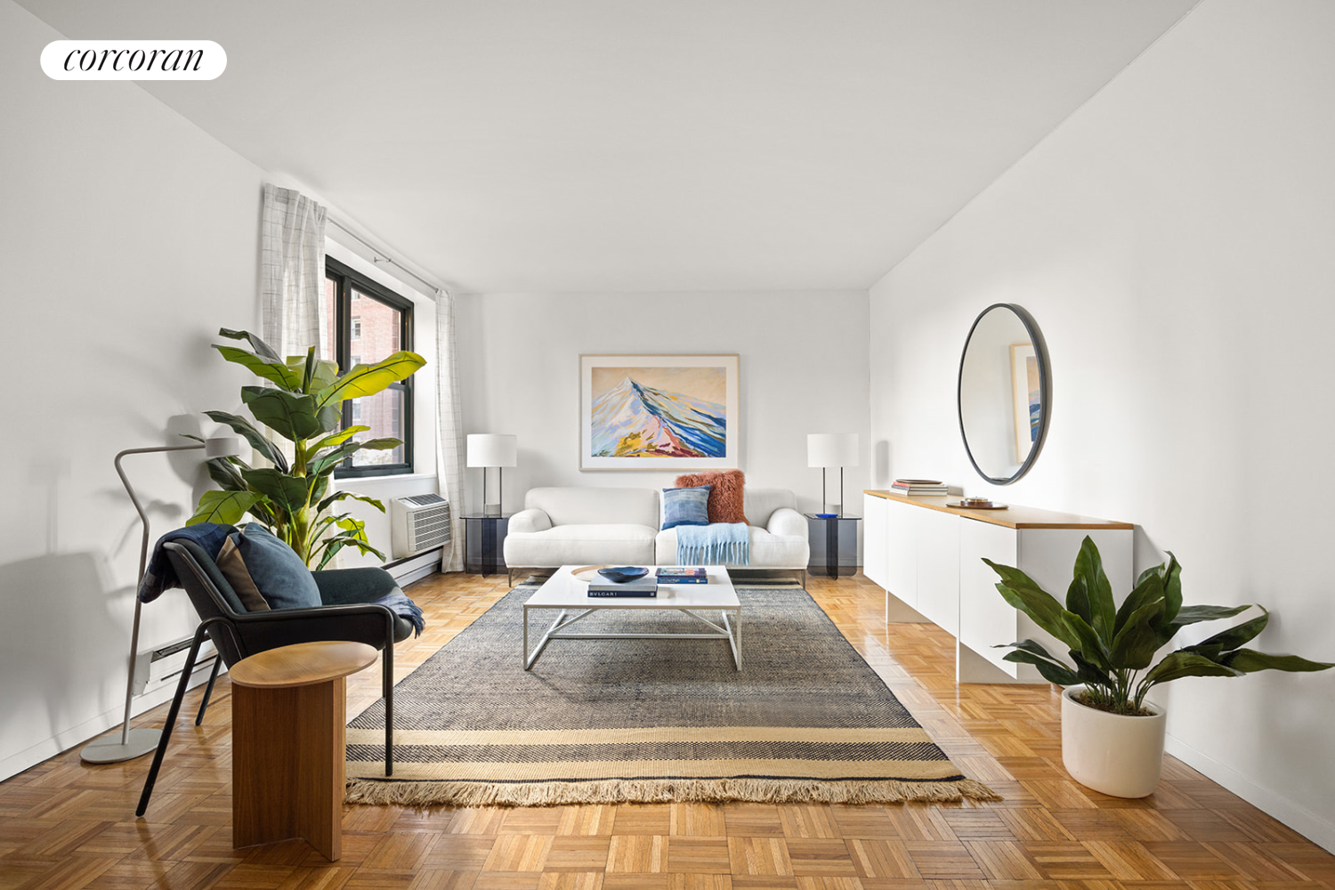 a living room with furniture a potted plant and a potted plant