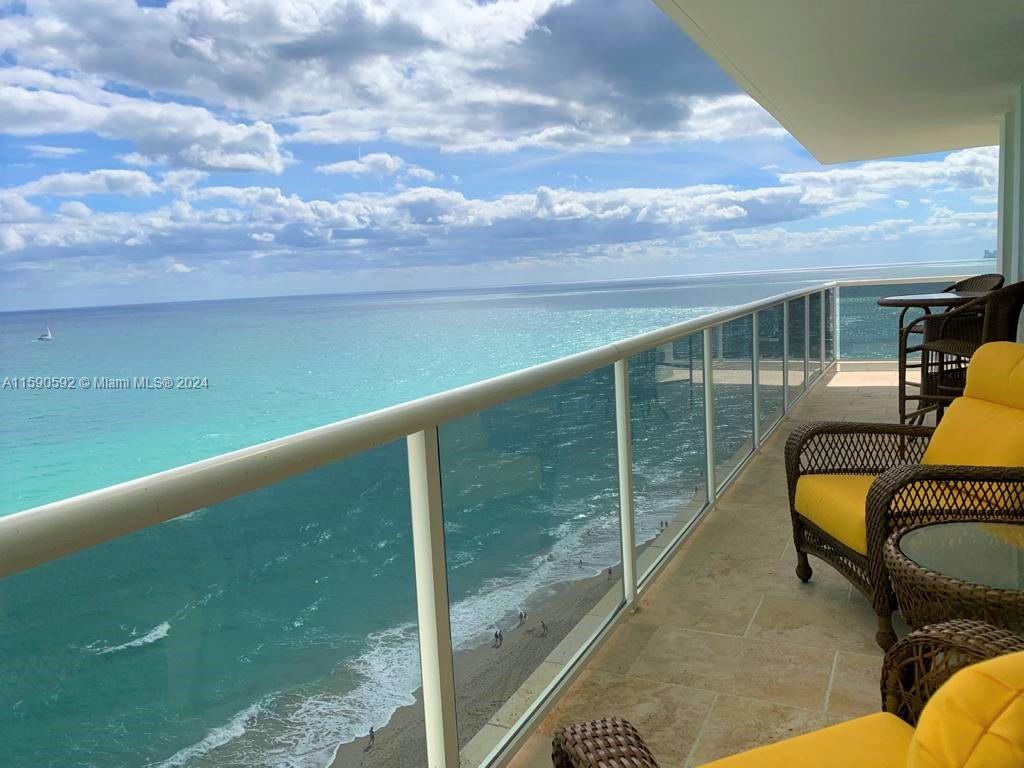 a view of balcony with furniture