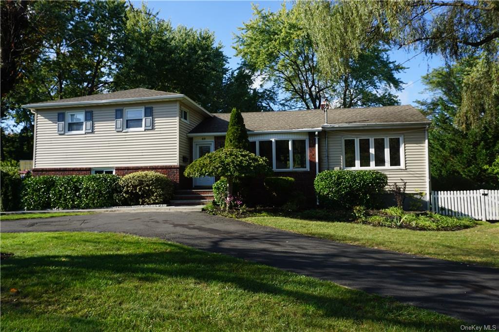 Tri-level home with a front yard