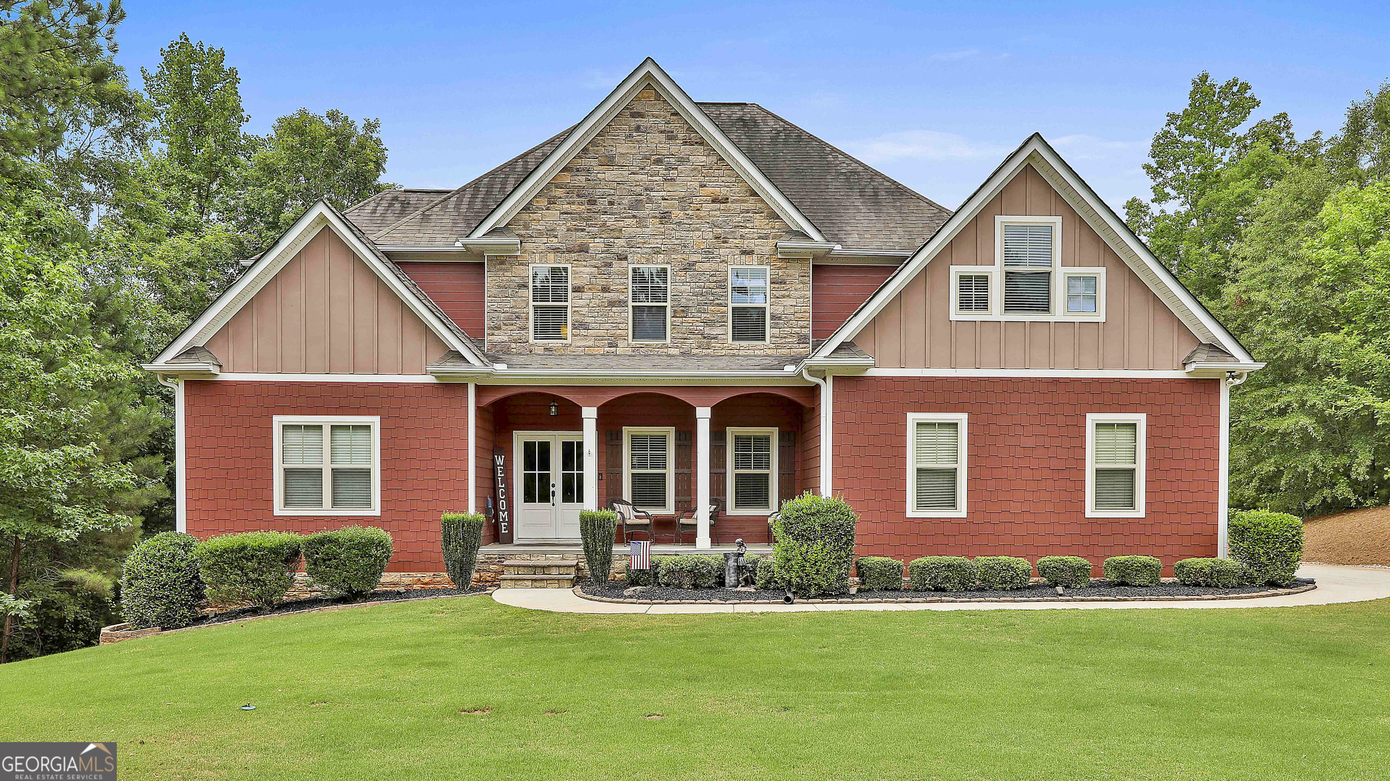 a front view of a house with a yard