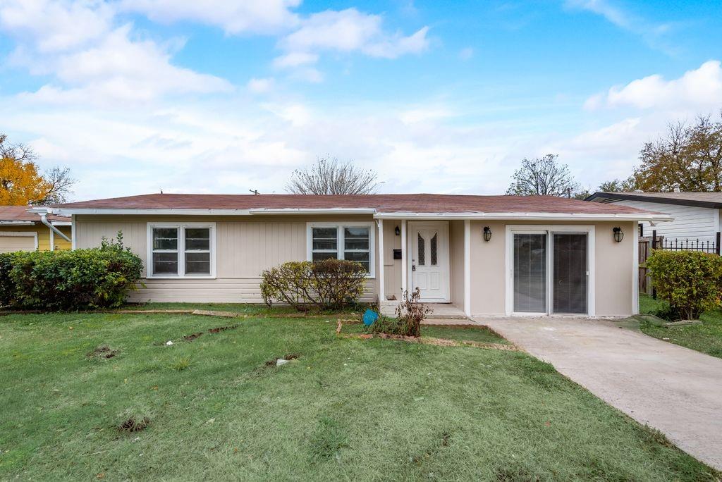 front view of a house with a yard