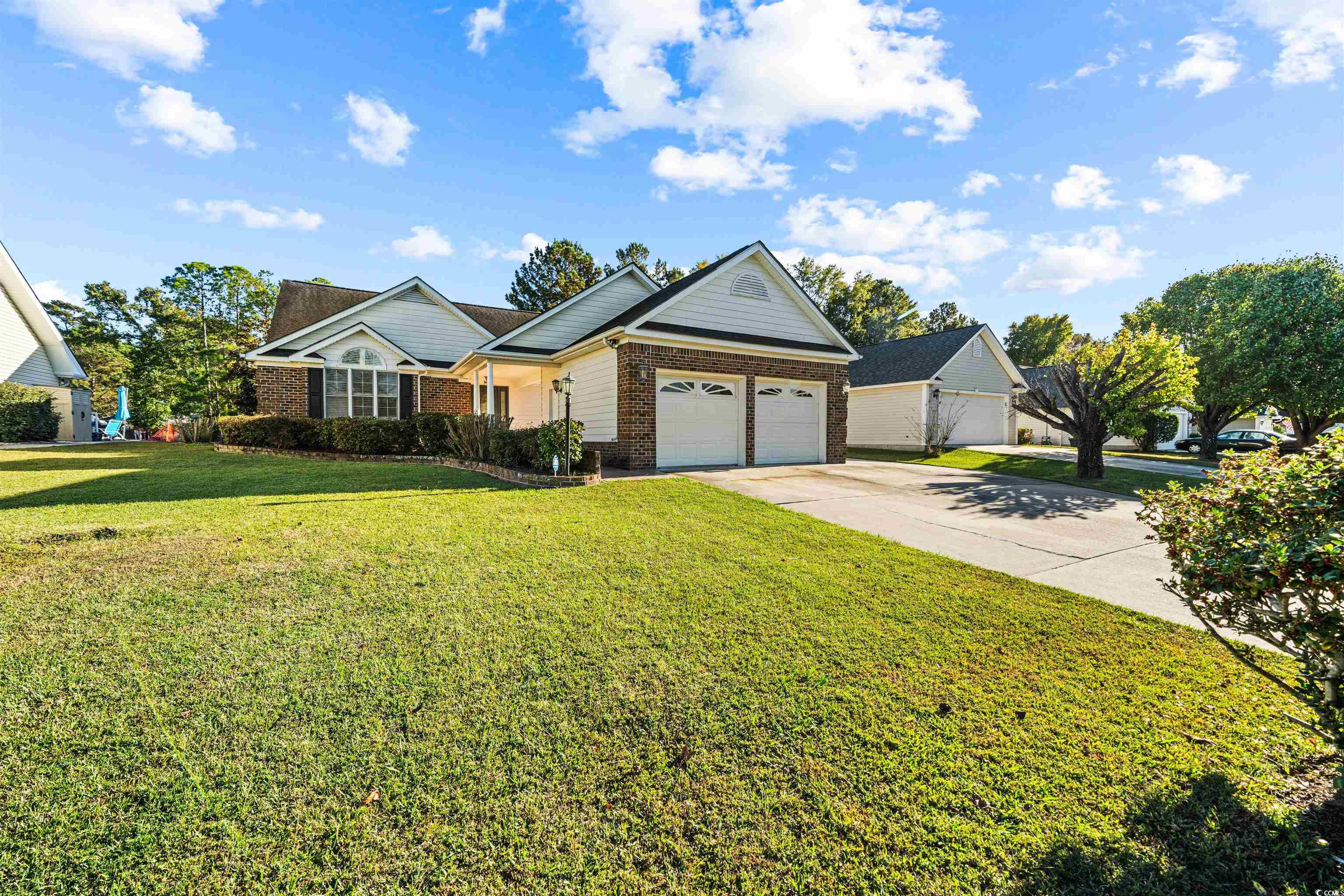 View of front of house featuring a garage and a fr