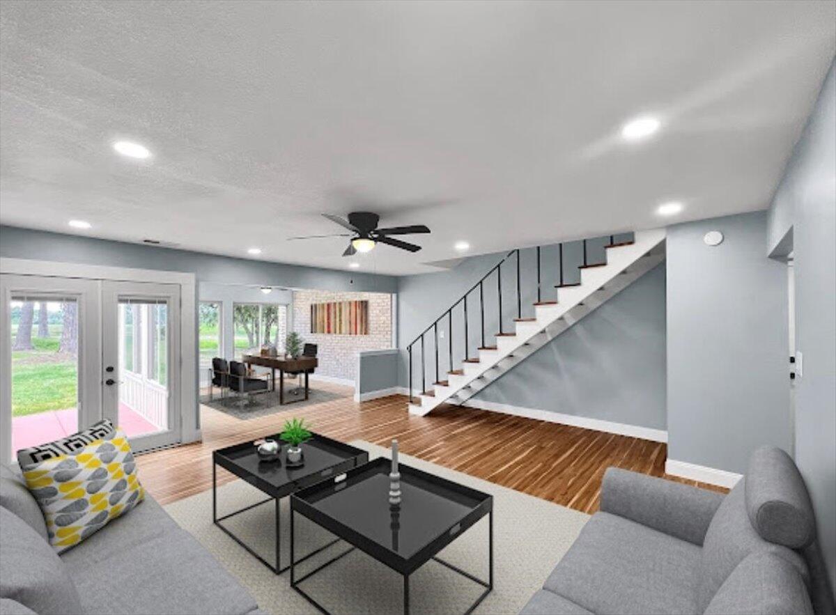 a living room with furniture and wooden floor