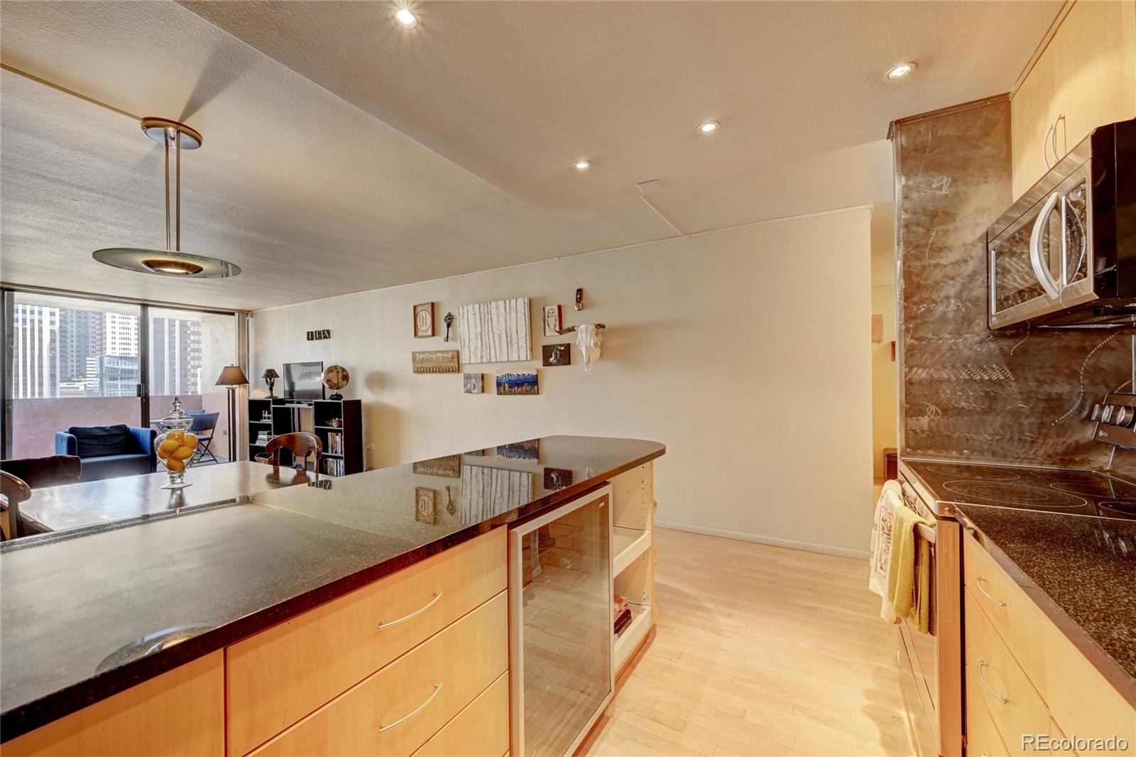 a kitchen with stainless steel appliances granite countertop a sink and cabinets