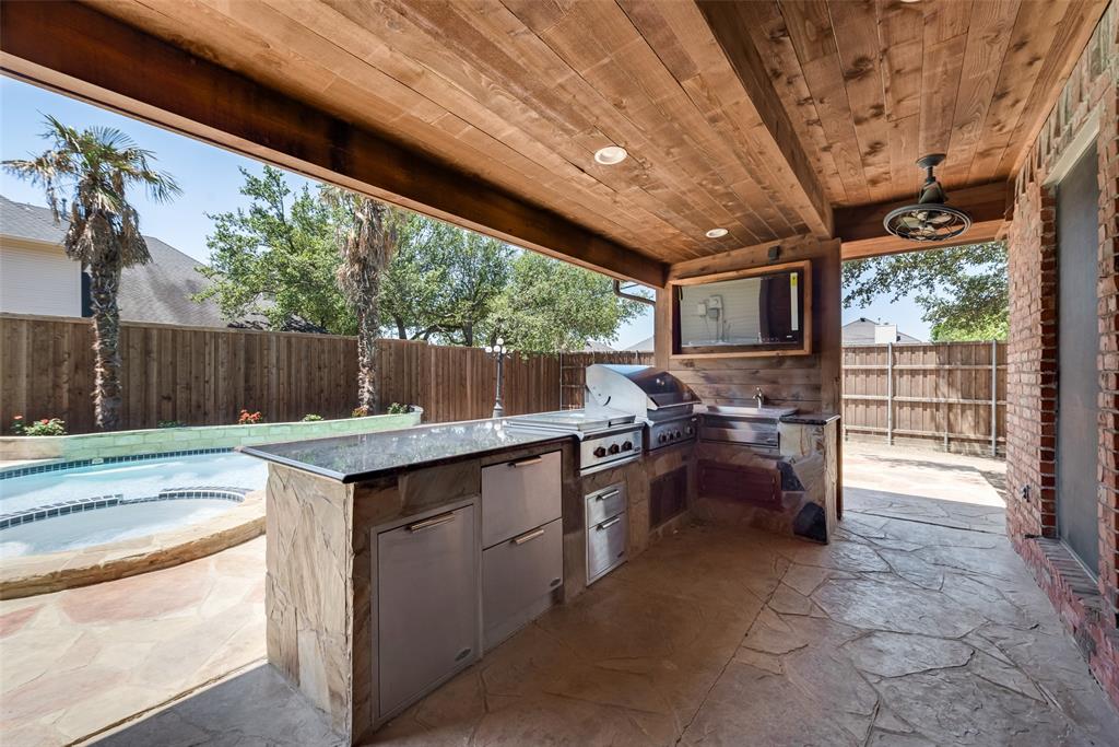 a kitchen with sink cabinets and outdoor space