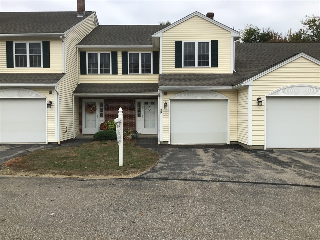 a front view of a house with garage