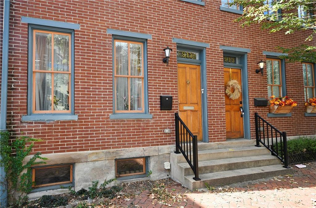 a view of front door of house with stairs