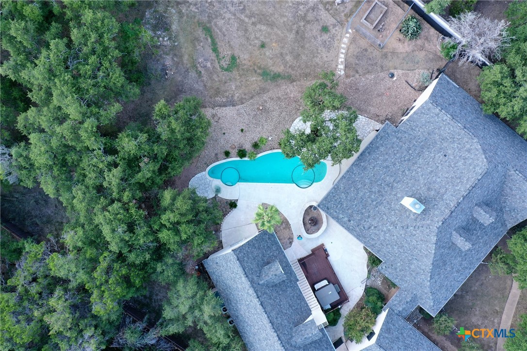 an aerial view of house with yard