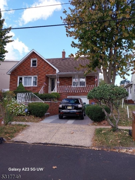 a view of a car parked in front of a house