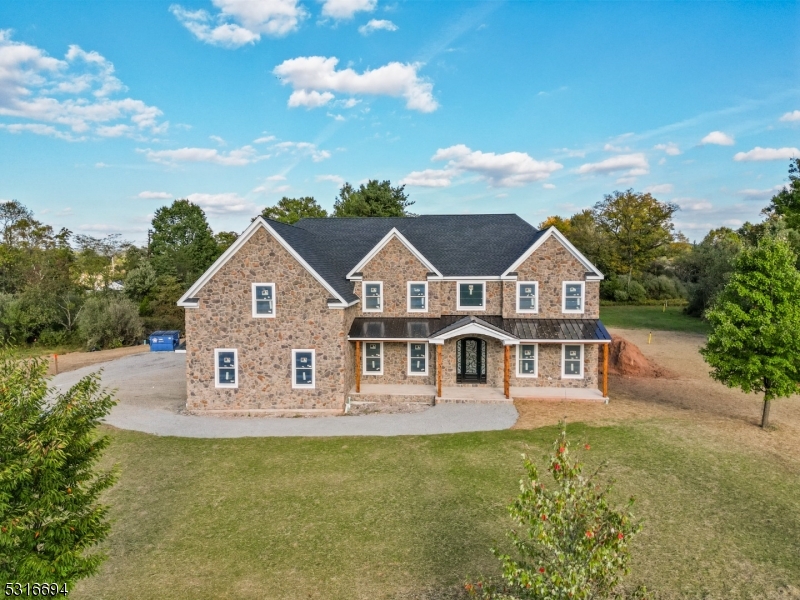 a view of house with garden and entertaining space