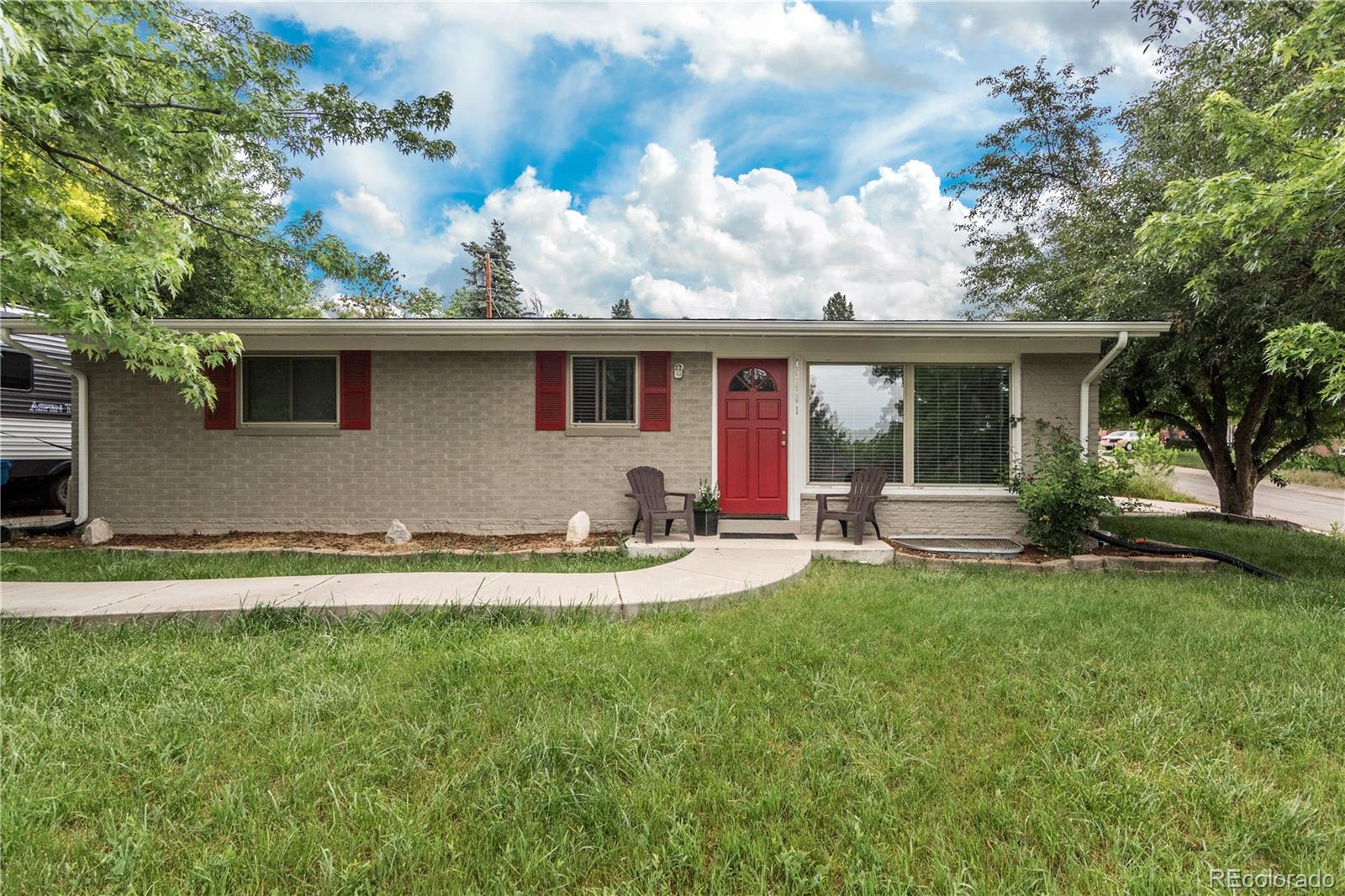 a front view of house with yard and seating area