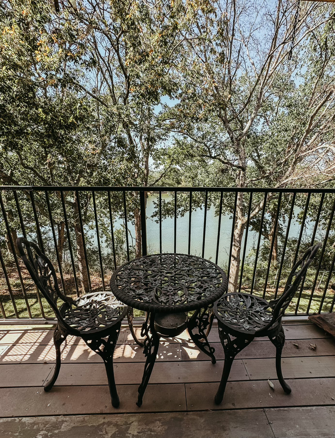 a view of balcony with wooden floor and outdoor seating