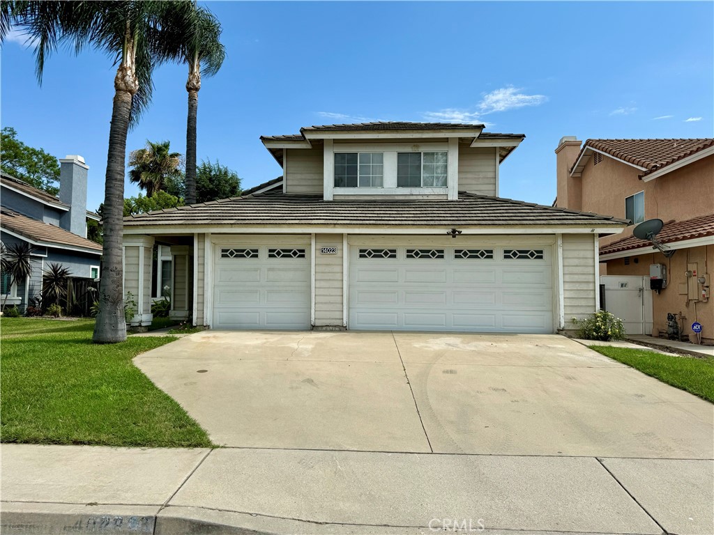 front view of a house with a garden