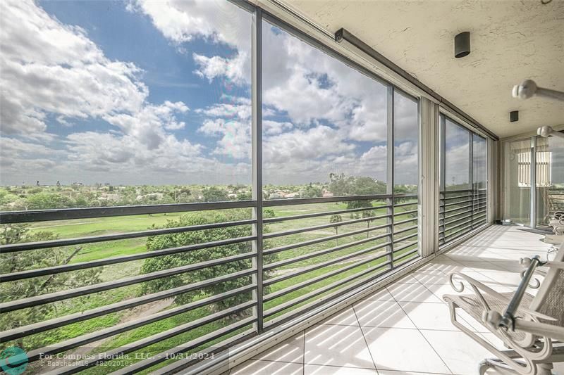 a view of a balcony with an ocean view