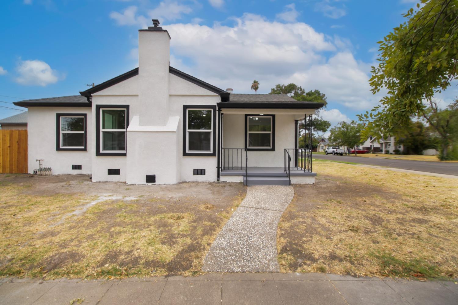 a front view of a house with yard