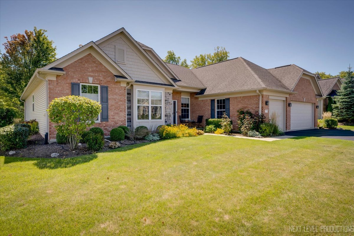 a front view of house with yard and green space