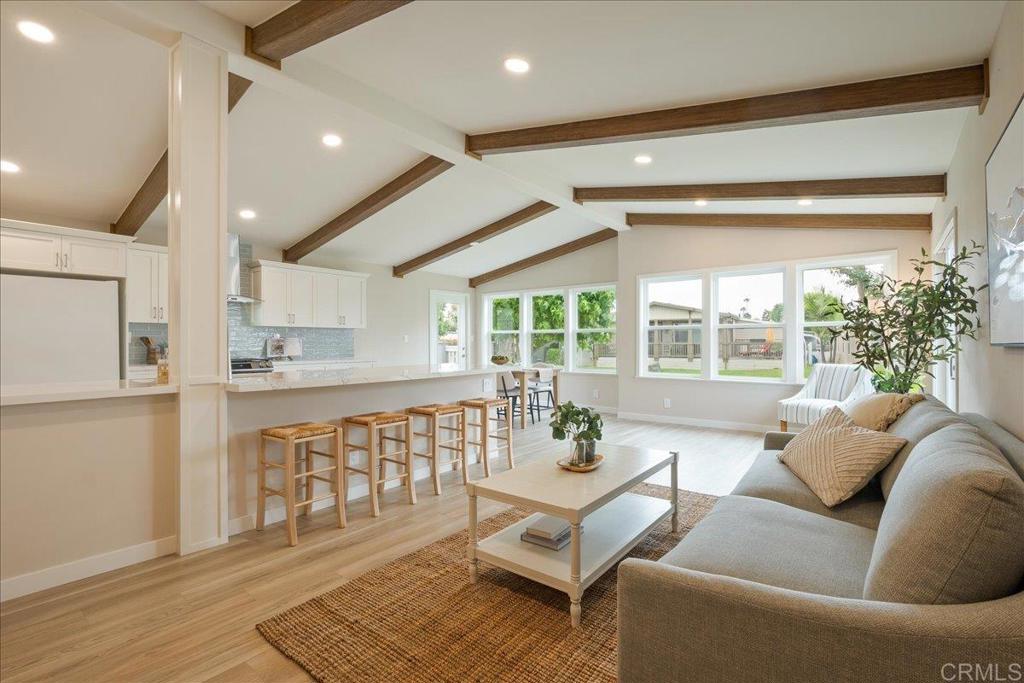 a living room with furniture and a table