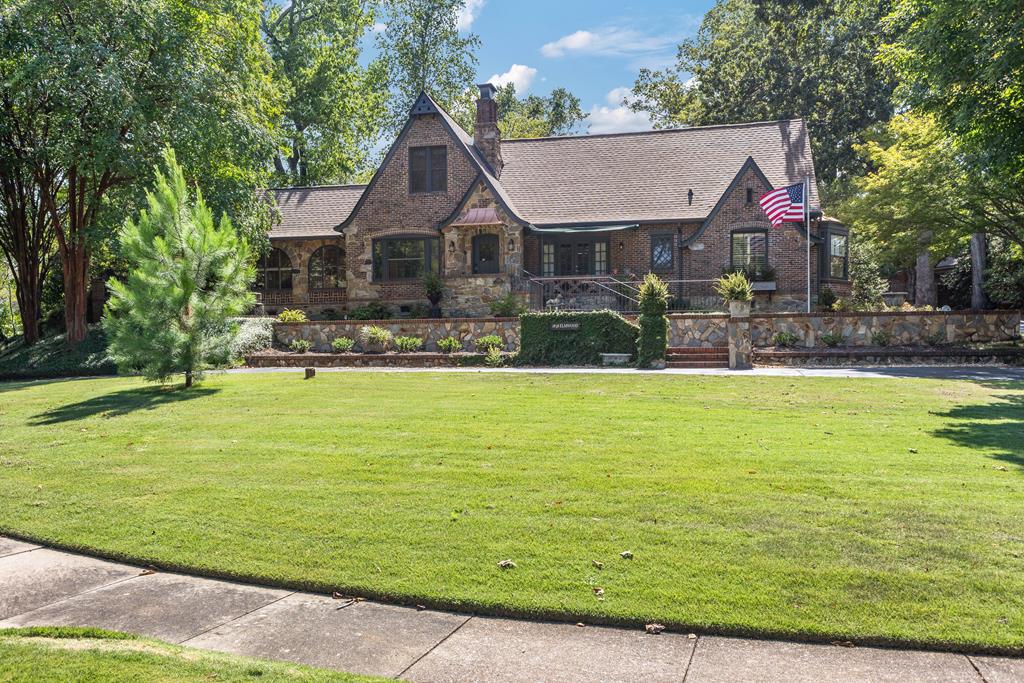 a front view of house with outdoor space and pool