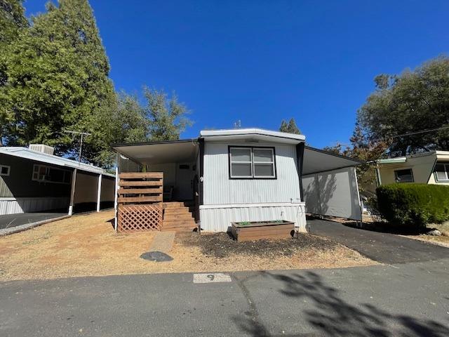 a side view of a house with a yard