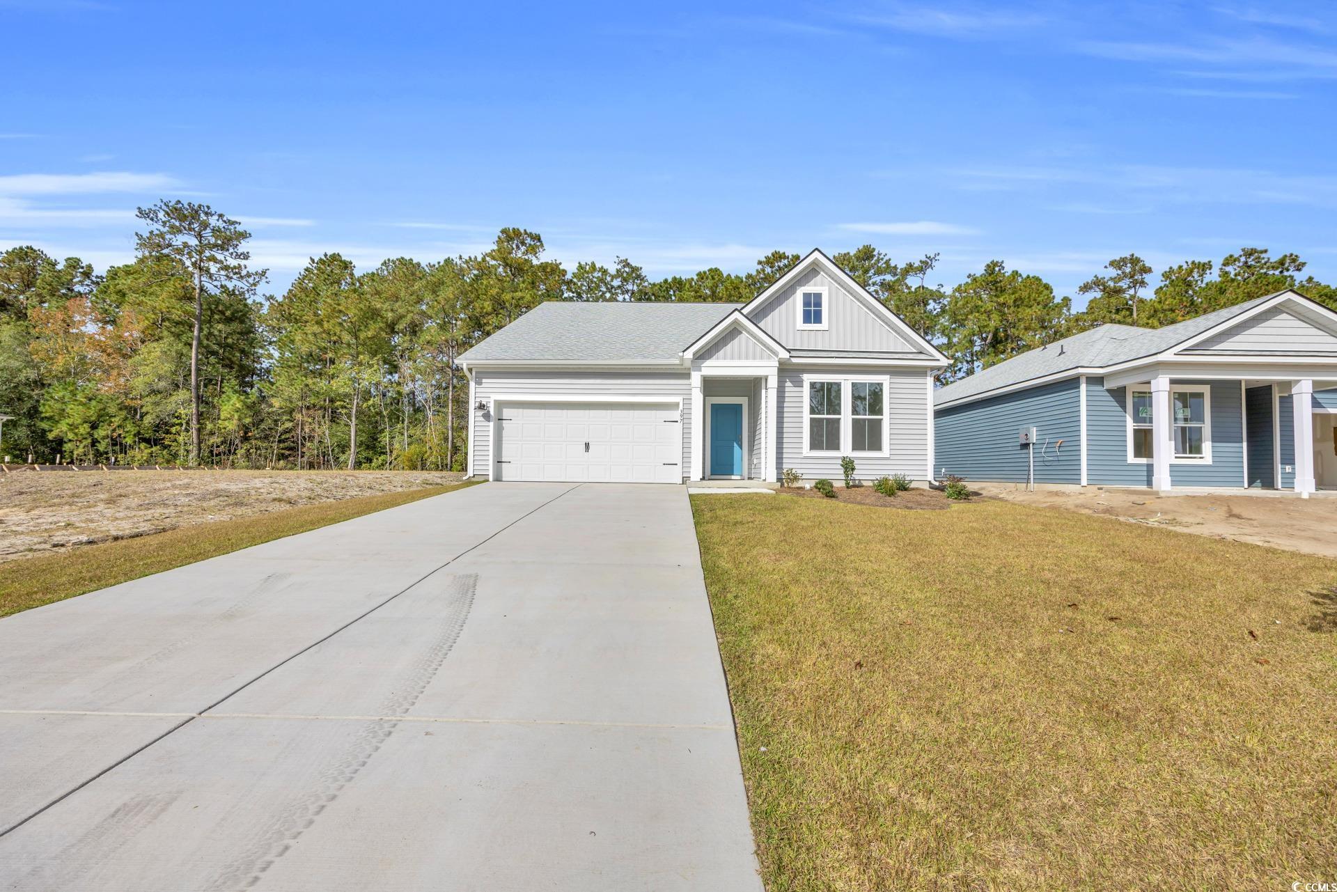 View of front of property with a front yard and a