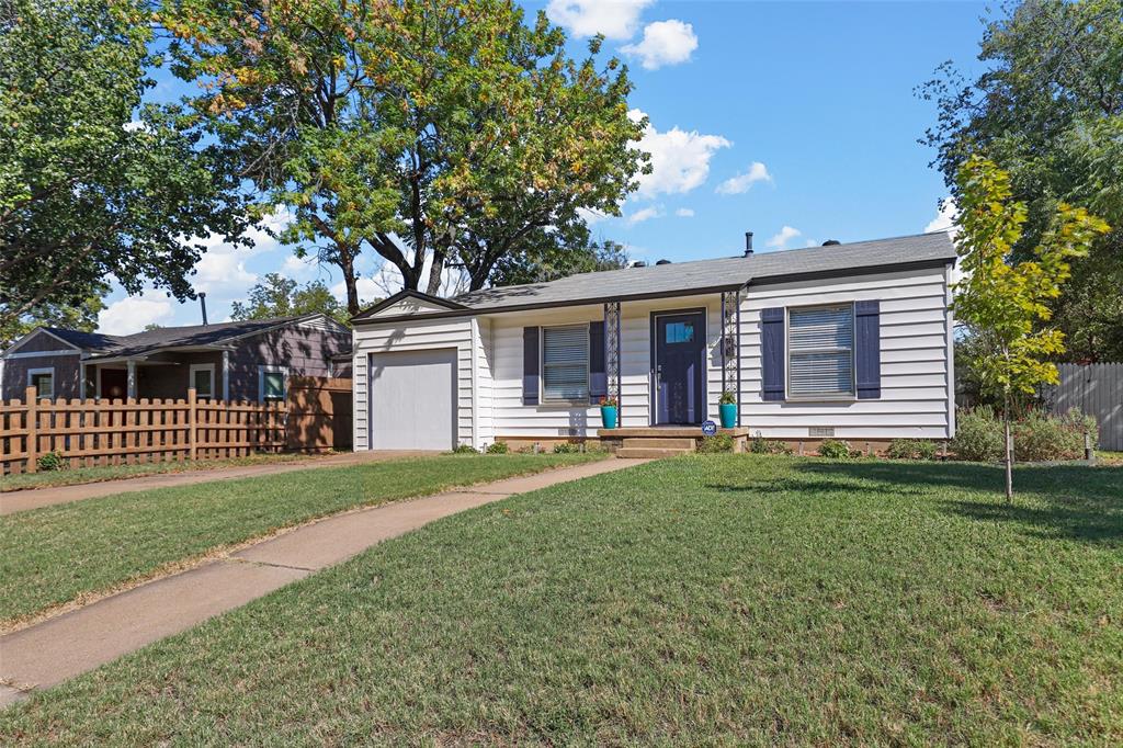 front view of a house with a yard