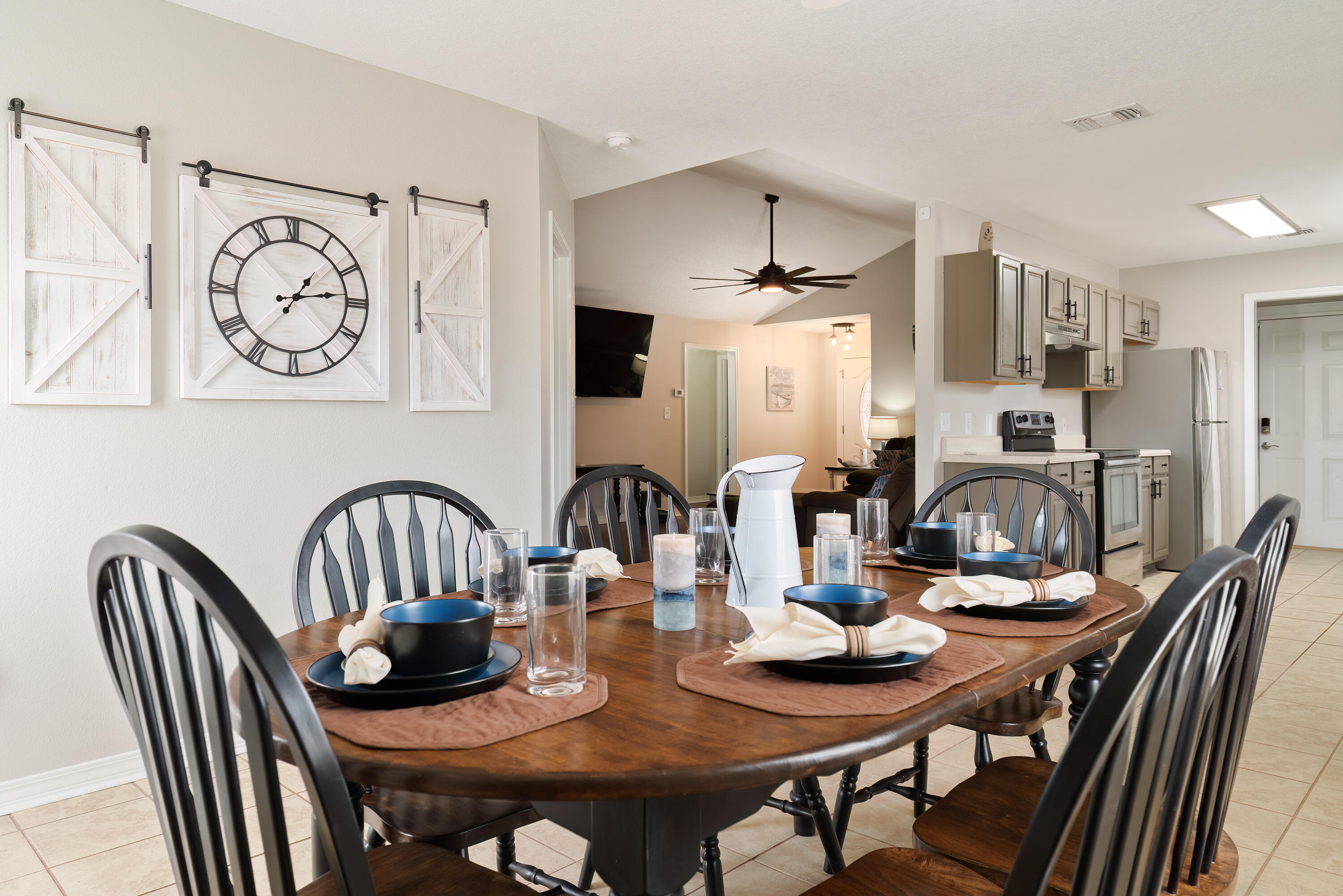 a view of a dining room with furniture and a chandelier