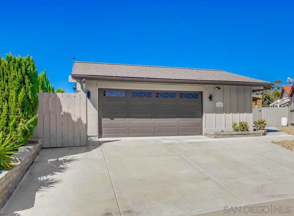 a front view of a house with a garage