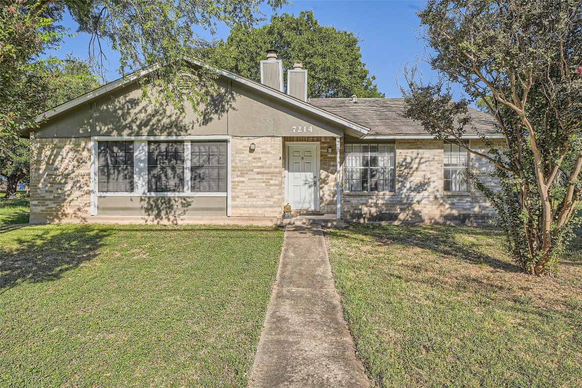 a front view of house with yard