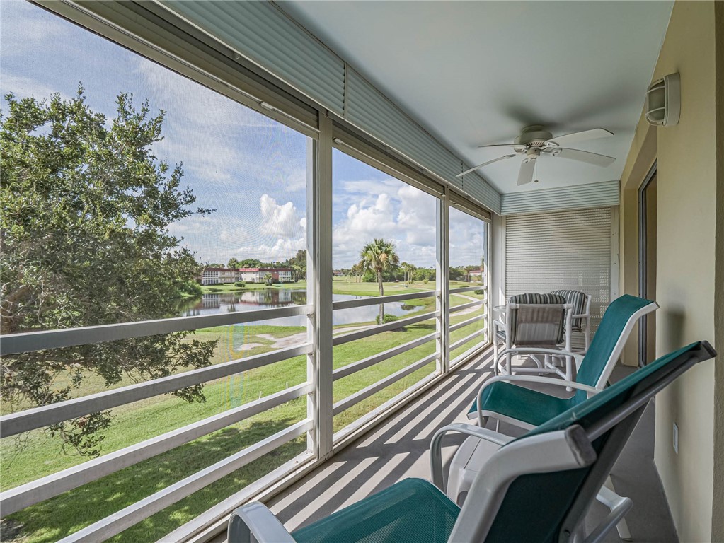 a view of a balcony with chairs