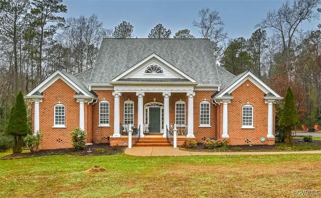 4 sides brick home sitting on 1.36 private acres