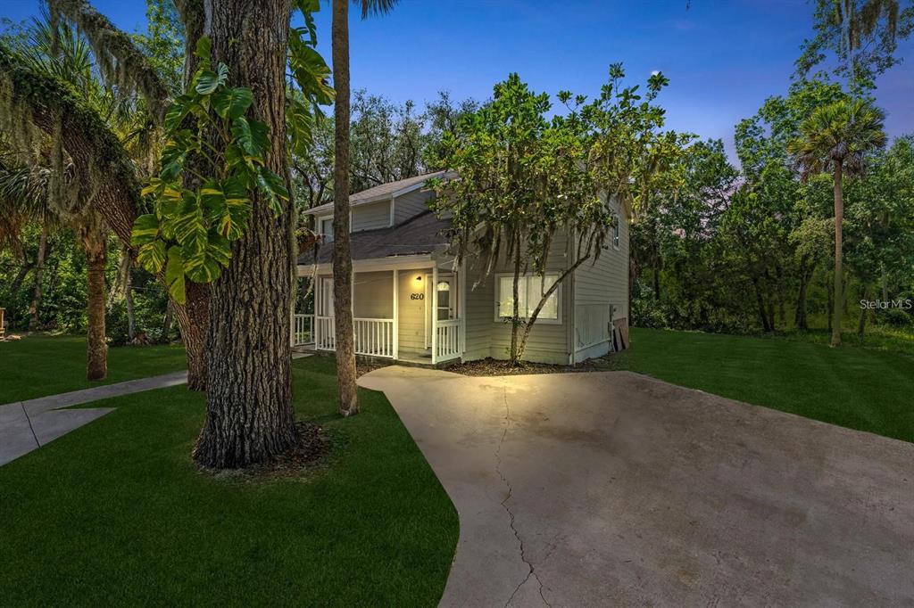 front view of a house with a yard