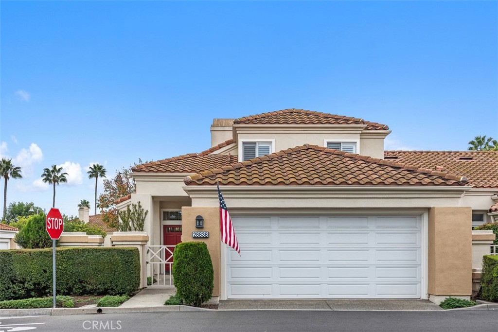 a front view of a house with a garage