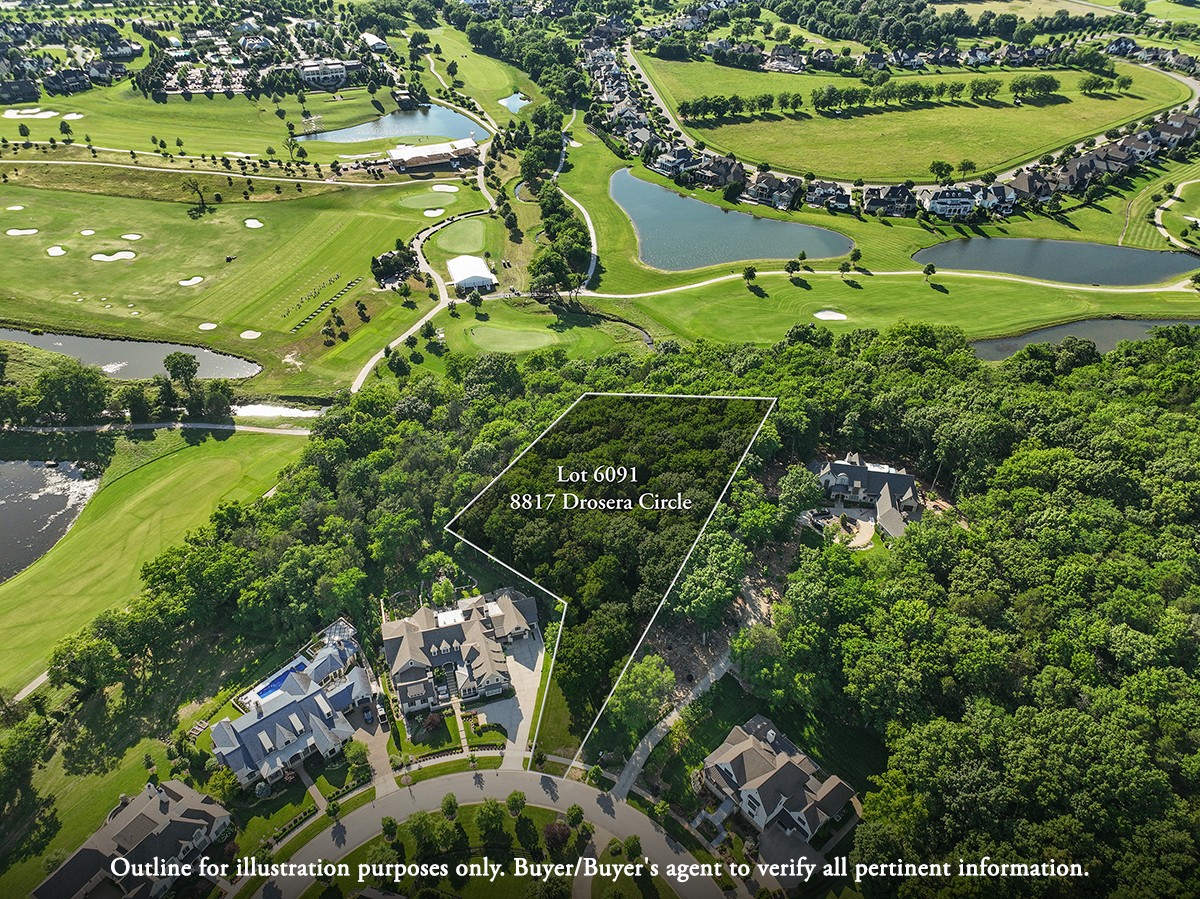 an aerial view of a residential houses and outdoor space