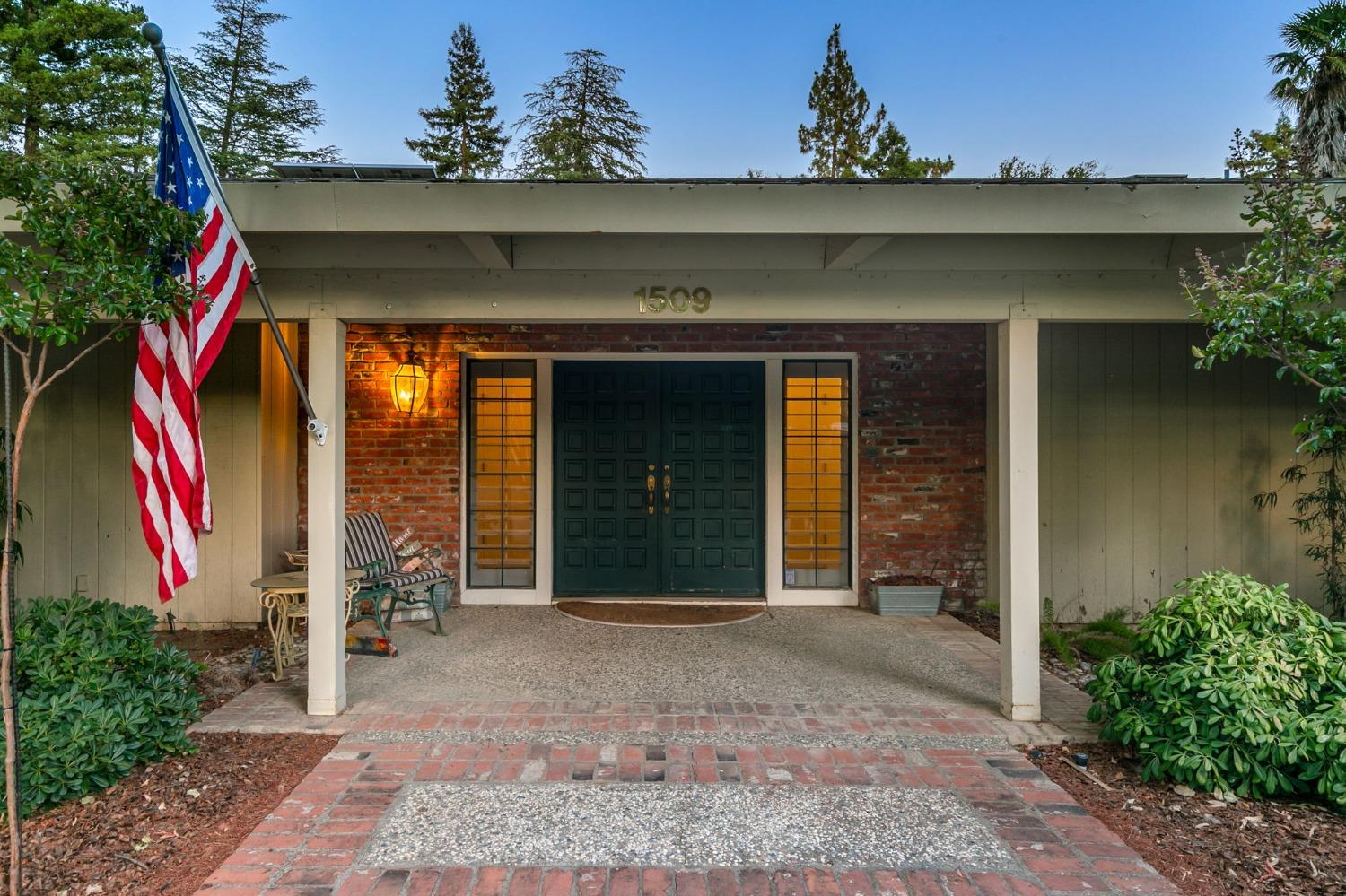 front view of a house with a yard