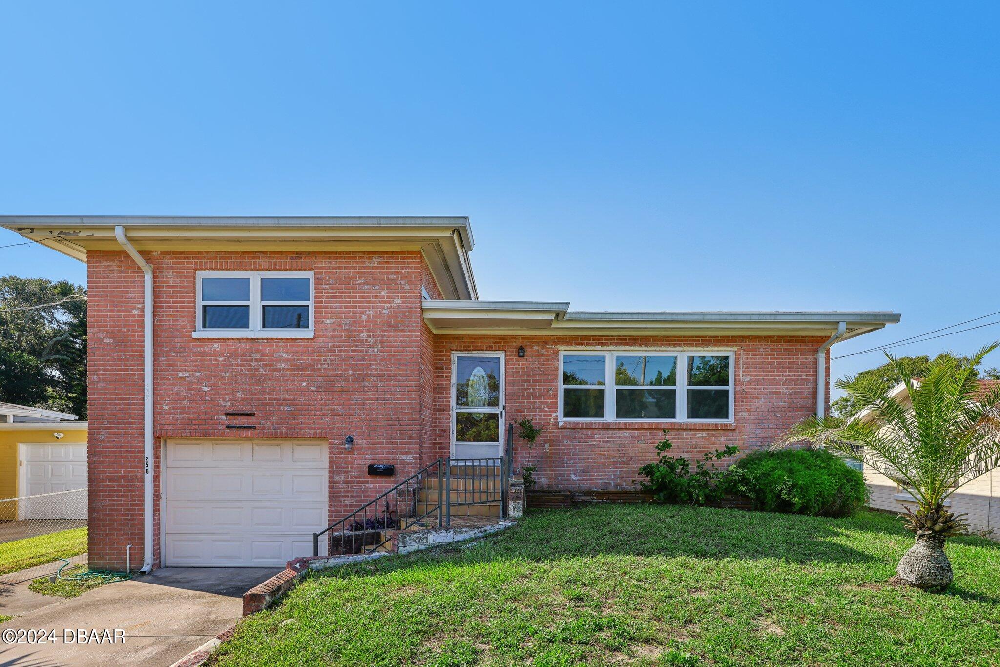 front view of a house with a yard