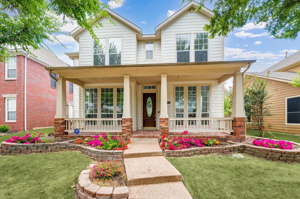 a house view with a sitting space and garden