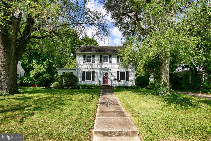 a front view of a house with yard