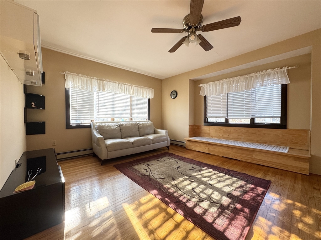 a living room with furniture and a rug