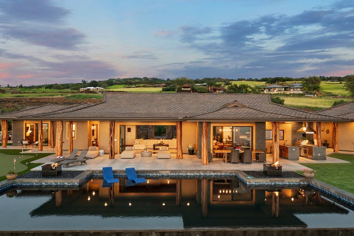 a view of swimming pool with outdoor seating