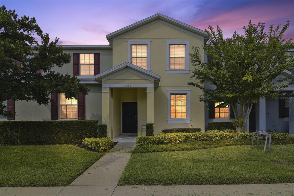 a front view of a house with a yard