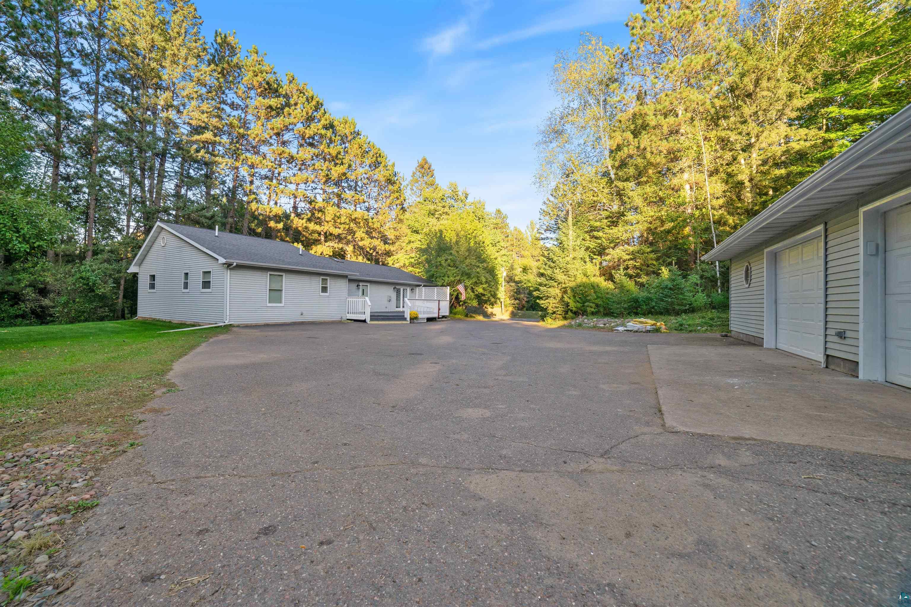 View of side of property featuring a garage