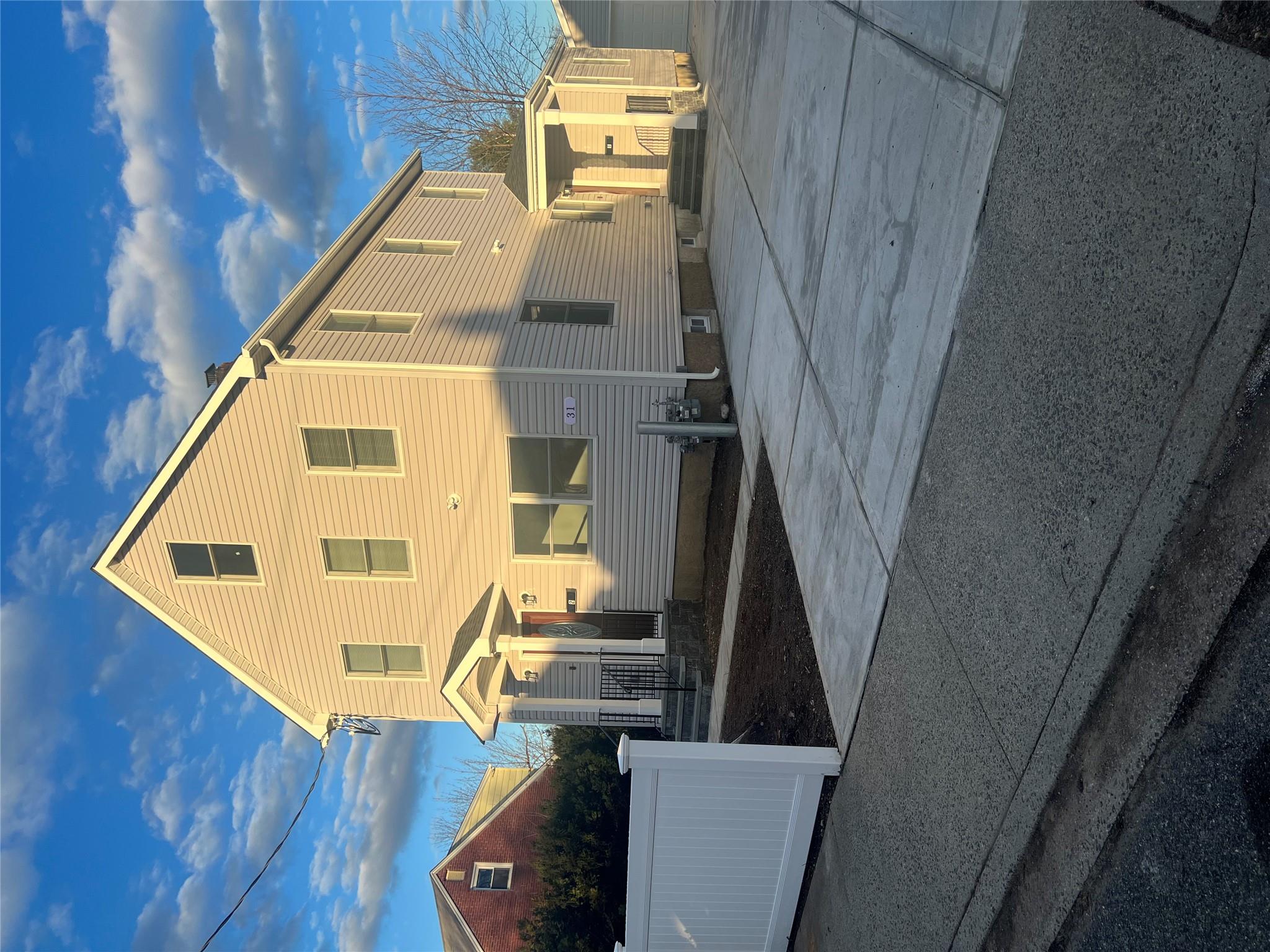 a view of a house with a street