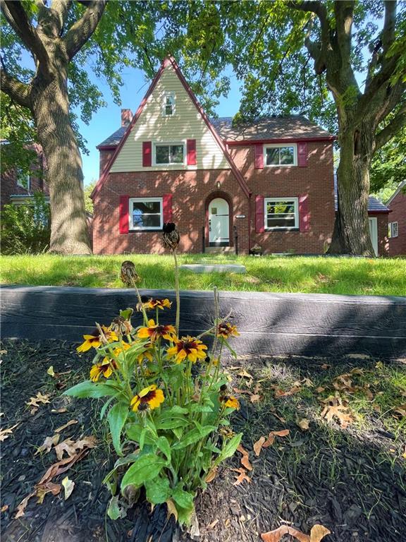 a front view of house with garden